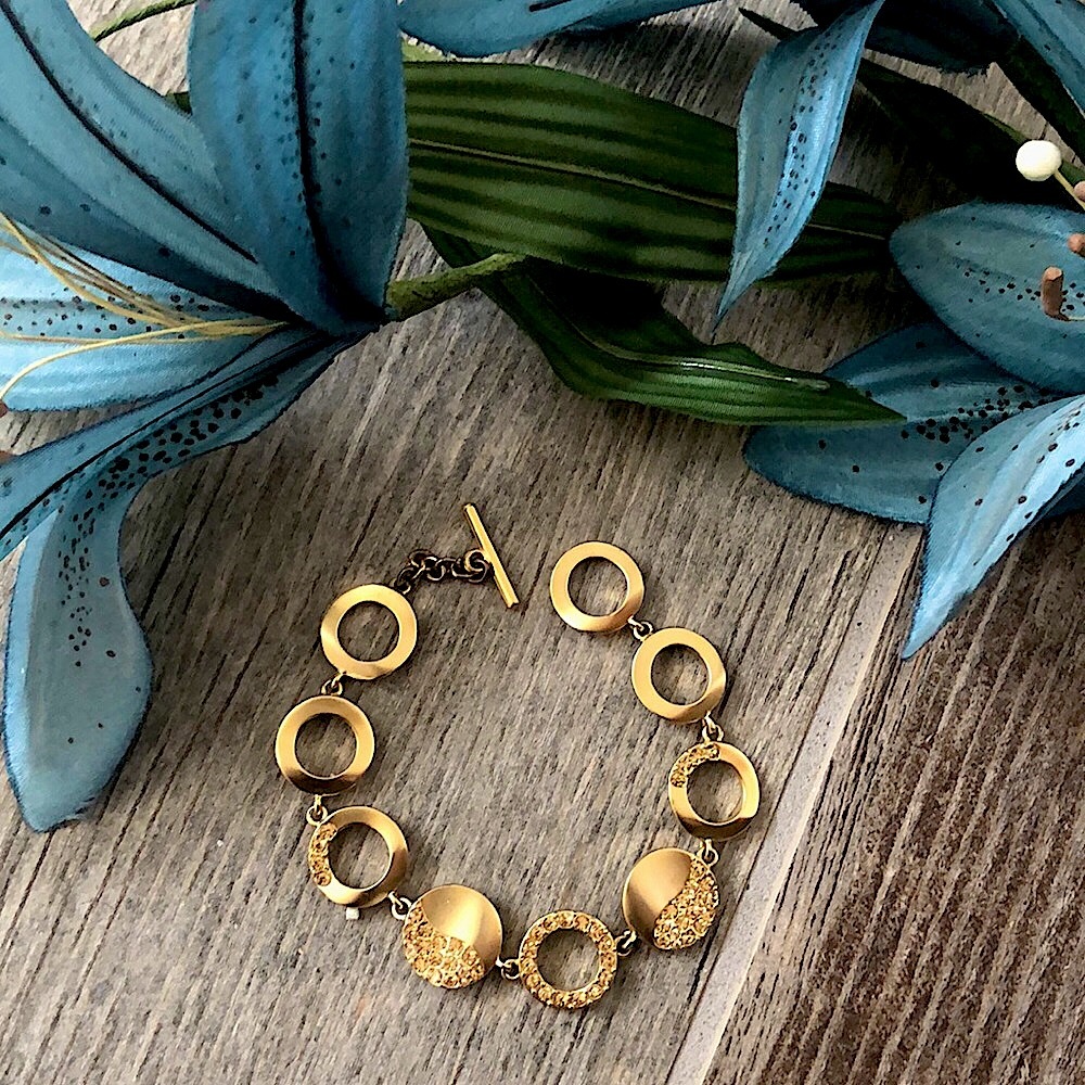 Macy's gold and rhinestone circular loop bracelet